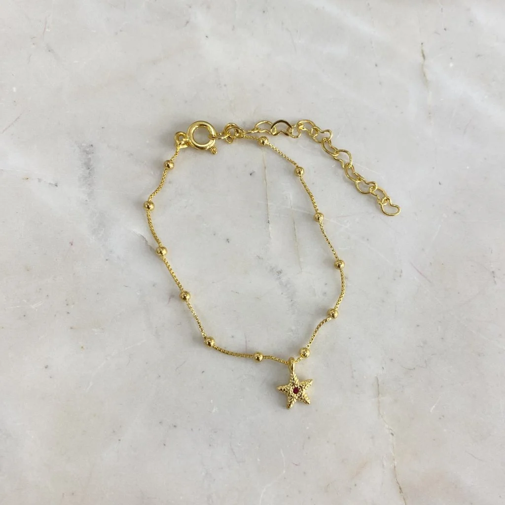 Pulsera infantil dijes de mar c/ pelotitas estrellita