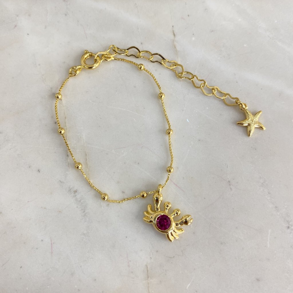 Pulsera infantil dijes de mar c/ pelotitas/cangrejo